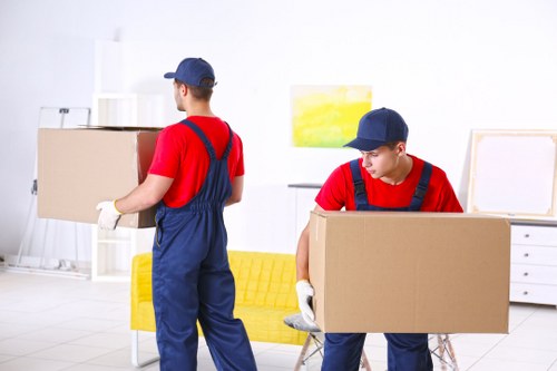 Furniture pick-up service removing a sofa from a Grove Park home