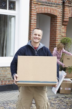 Removal van and packed boxes outside a Grove Park home