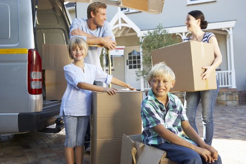 Loading items into a van for a Grove Park move